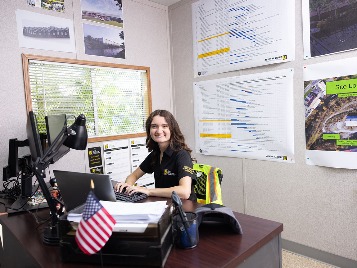 A young marketing professional sits at her desk